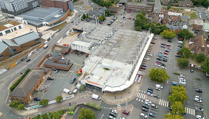 Rotating Aerial Shot Of A Supermarket In Canterbury